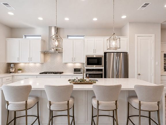 Virtual representation of the kitchen updated with new backsplash and countertops.