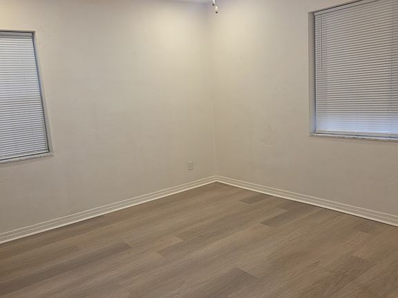 bedroom with built in closet, ceiling fan, 4 new wafer lights on dimmer.