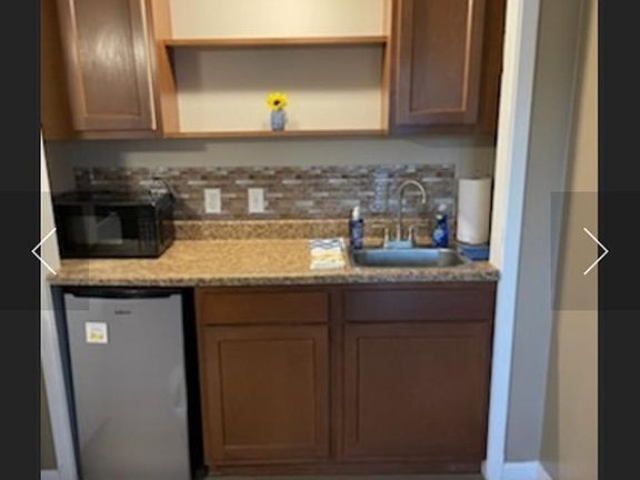 Small studio apartment. There is no stove or big refrigerator only comes with microwave, mini refrigerator, hot plate, and griddle.