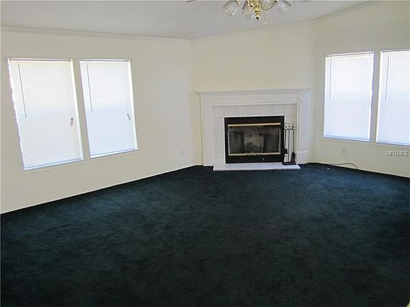 Spacious family room with wood burning fireplace