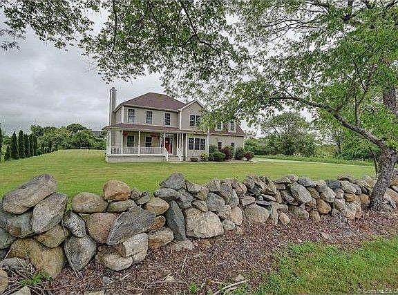 Front View from street with Rock wall