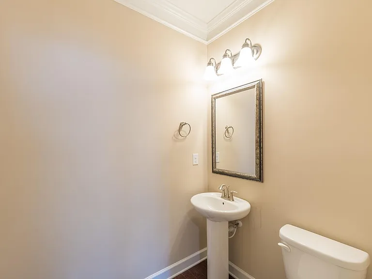 Powder room right across the formal dining area