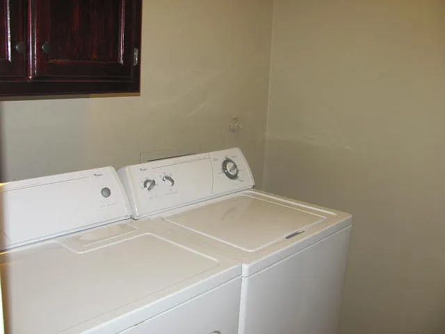 Laundry with cleaning storage above