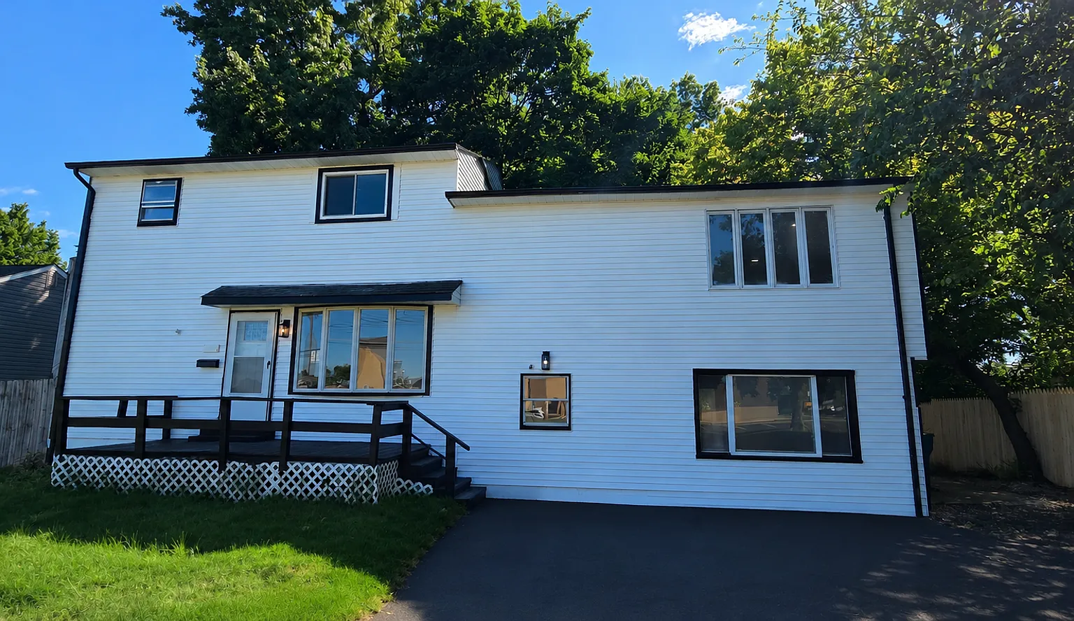 Freshly Updated 6-Bedroom Home with Yard & Driveway — Photo 1