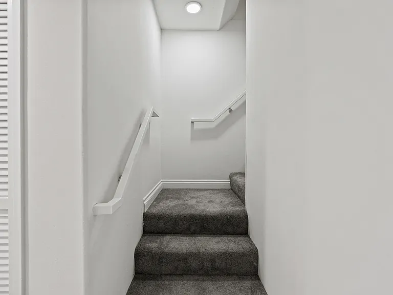 Staircase to Upper Level of Apartment Home