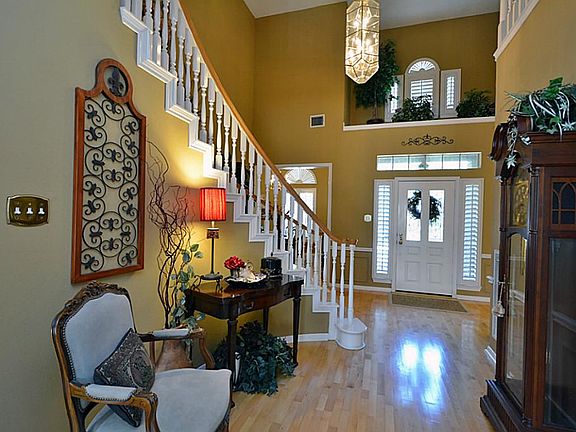 The foyer entrance is true elegance with spiral style staircase and soaring high ceilings.