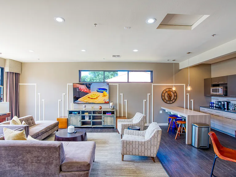 Resident lounge with shuffleboard and comfortable seating