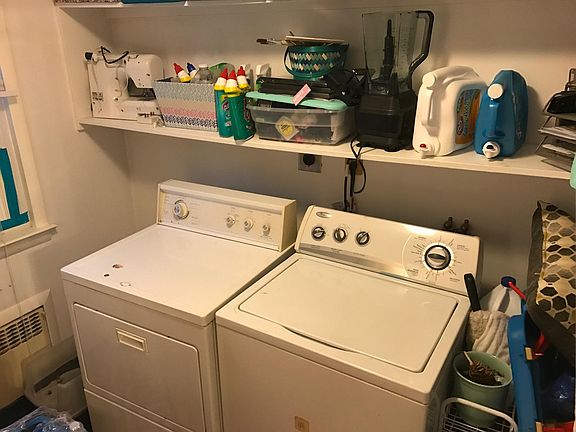 laundry room with storage