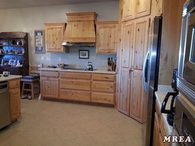 Kitchen with knotty alder cabinets