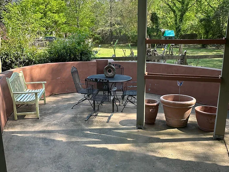 Private patio with furniture. Plant all the flowers, vegetables and herbs you like.