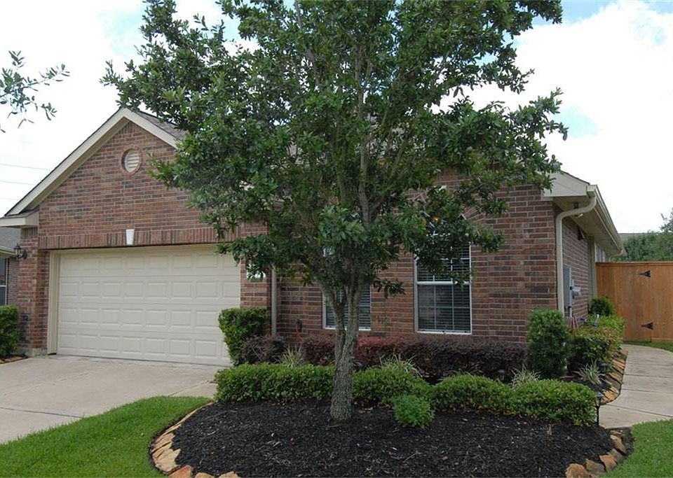 Front View showing one of two live oaks