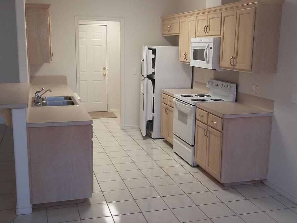 kitchen, utility rm, door to garage viewed from dining rm.