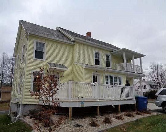 Side view of home with decks