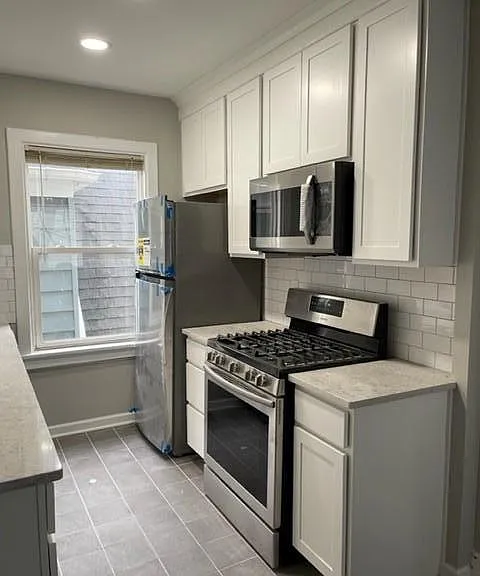 Gas oven, garbage disposal, microwave - hardware on cabinets will be installed