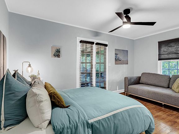 Master Bedroom with Queen sofa bed. French doors enter into enclosed patio