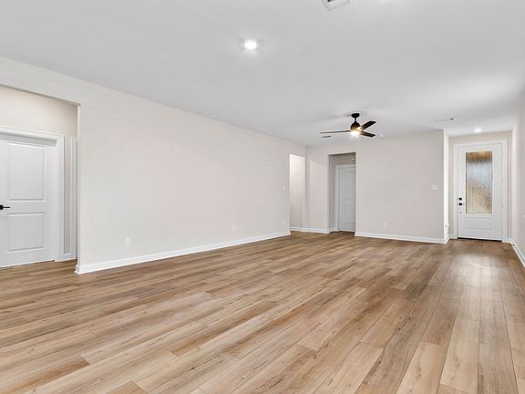 The entryway is highlighted by this gorgeous 3 4 lite door!