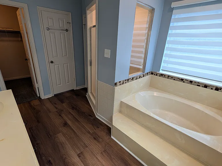 A large garden tub, a shower with handheld head, a huge closet and double sinks make this a perfect place to start and end your day.
