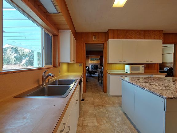 Downstairs 16'x15' kitchen with center island, under cabinet lights.
