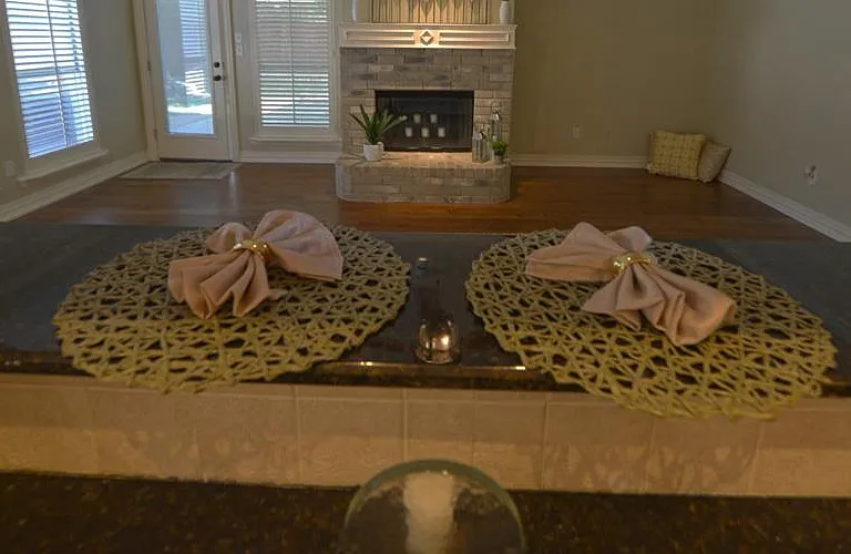 Pass-through bar from kitchen to family room with fireplace