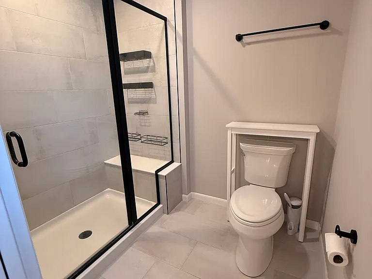 Extra large shower and seating area in primary bathroom with plenty of space for two - woo hoo!