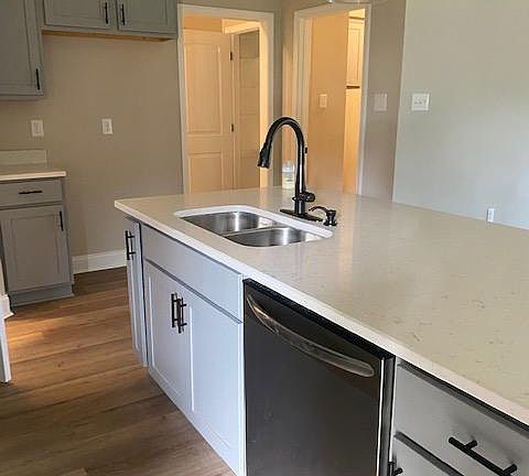Kitchen island with sink and dishwasher