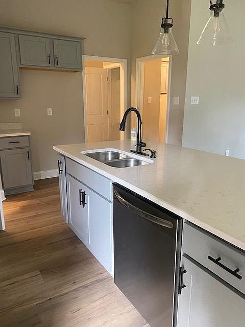 Kitchen island with sink and dishwasher