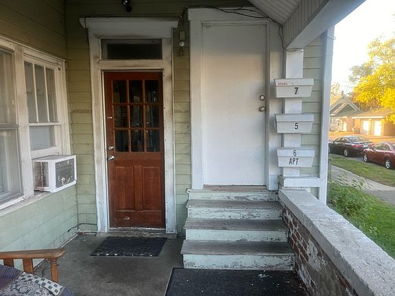 Shared front porch. Units 5, 6 & 7 are upstairs.