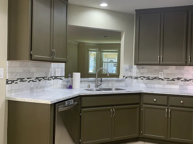 Kitchen with open view of the living room