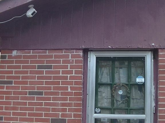 Outside side door with Ring security camera