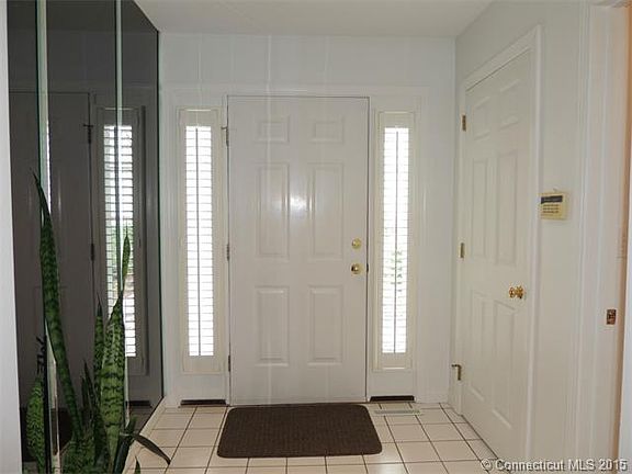 Inviting foyer with custom ...