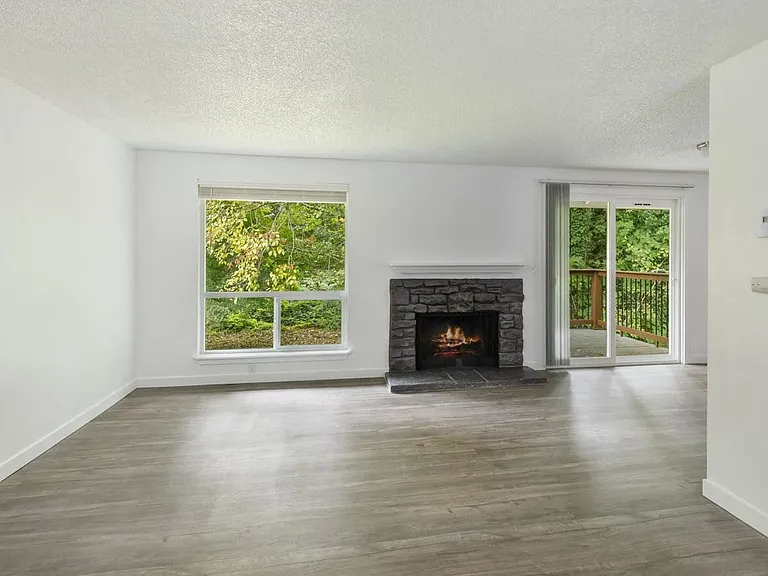 Interior Living Room with Fireplace at Wilderness West Apartments in Olympia, Washington