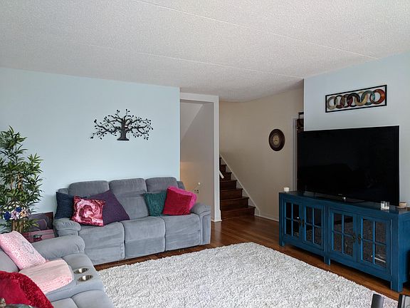 Living room comfortably fits sectional AND