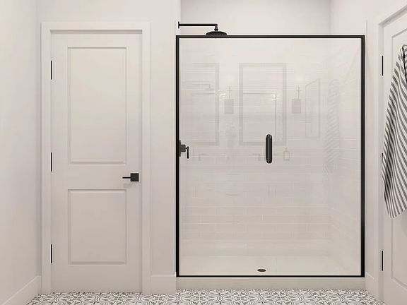 Primary bath with glass shower enclosure