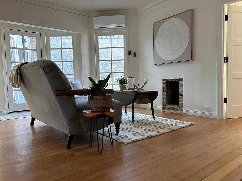 french windows throughout home. Original hardwood flooring