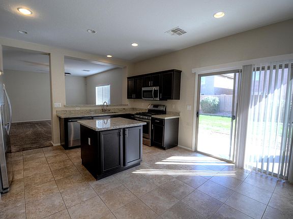 Kitchen includes upgraded, stainless steel appliances, granite counter tops, with a gas range.
