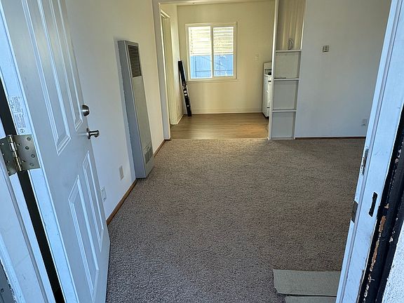 Upon entering front door is the living room w/new carpet