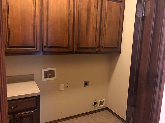 Laundry room off of kitchen area and garage