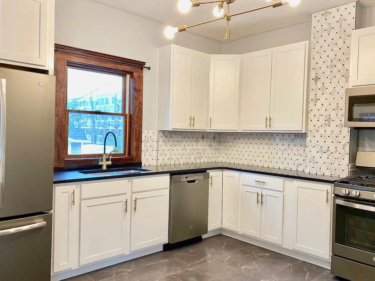 All new kitchen featuring natural marble backsplash - 1346 Edwards Ave