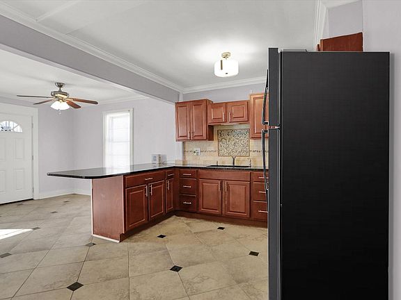 Large open design kitchen with stainless steel appliances