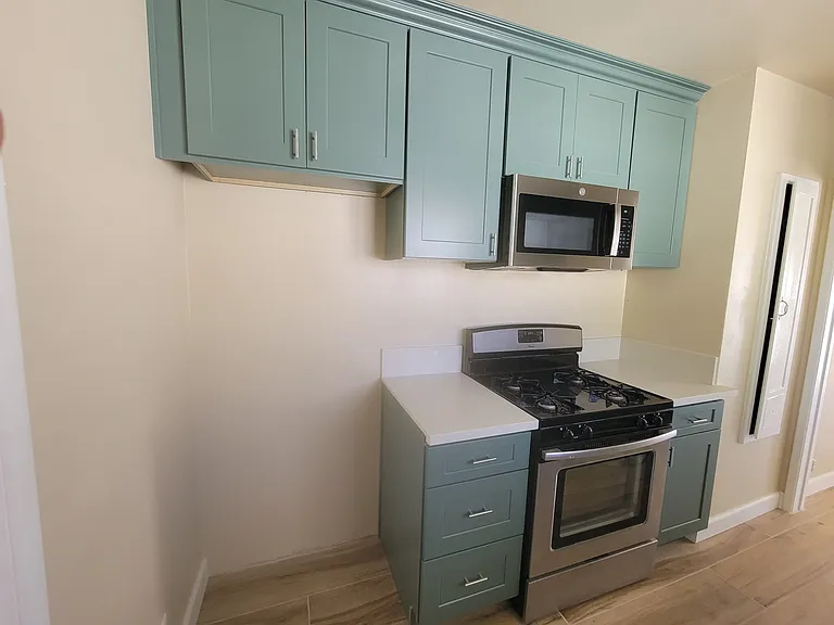 4-burner stove/oven and cabinets. Refrigerator will be included.