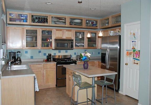 Top-of-the-line stainless appliances, gas range, glass front maple cabinets!