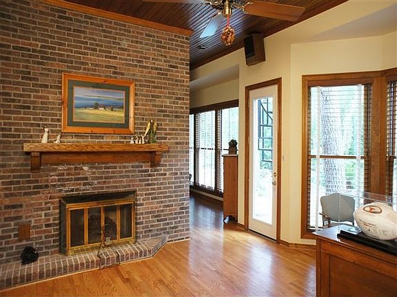 A huge brick fireplace warms up the gameroom and wetbar. 