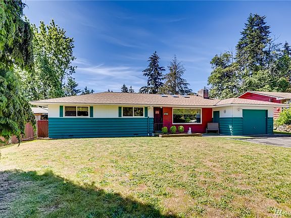 This charming rambler has a large front yard and one car attached garage. 