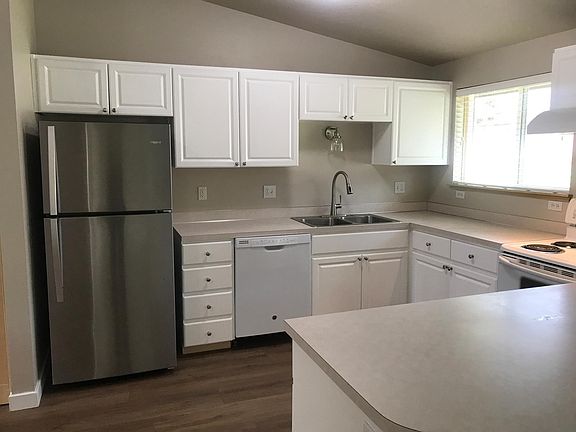 Large kitchen, new fridge, lighting. Lots of cabinet and countertop space.