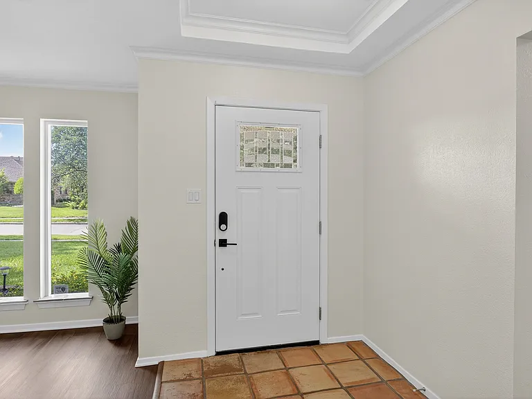 Front door with electronic deadbolt entry