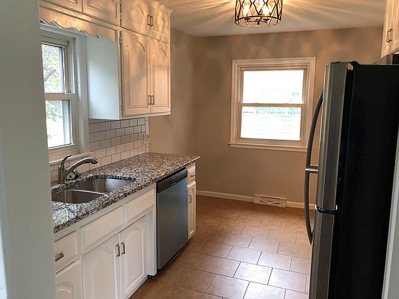 Kitchen view, standing from the living room entrance.