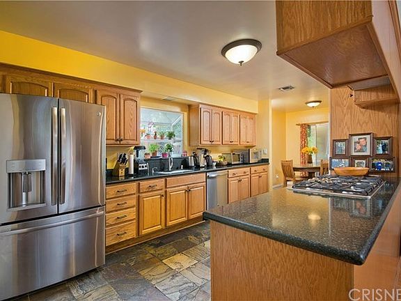 Kitchen with Granite Counters, Slate Floor, Stainl
