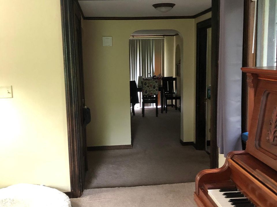 from living room to hall (bathroom on left) bedroom to the right; dining through archway