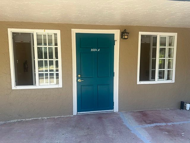 Front Door to Duplex- new paint, flooring, fixtures.
