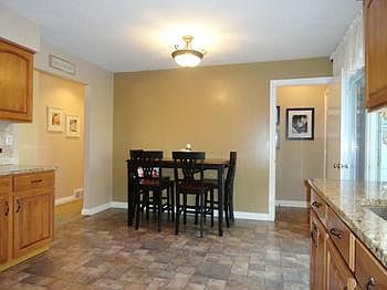 Wait until you see this fully equipped kitchen!  You're going to just love the hickory cabinetry topped with solid high end gleaming durable granite countertops!  And the newer laminate easy care flooring with it's attractive stone pattern adds the finishing touch to this wonderfully spacious "heart of the home"!